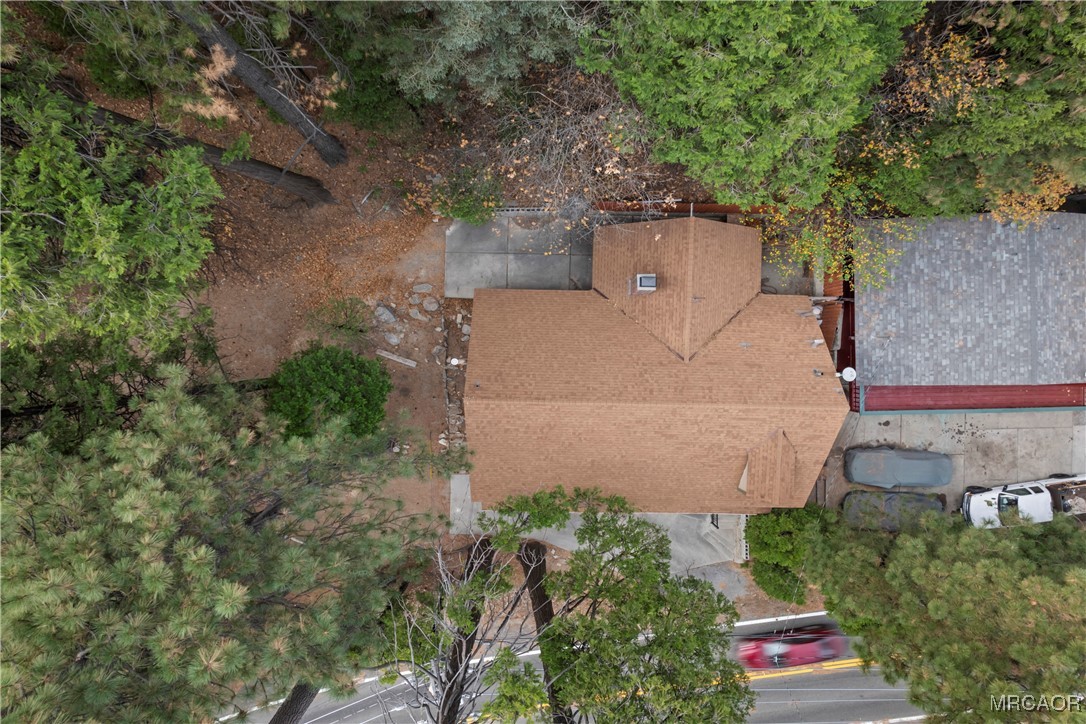 26791 Highway 189 Twin Peaks, CA 92391 - Photo 36 of 39 an aerial view of a house with a yard and large trees