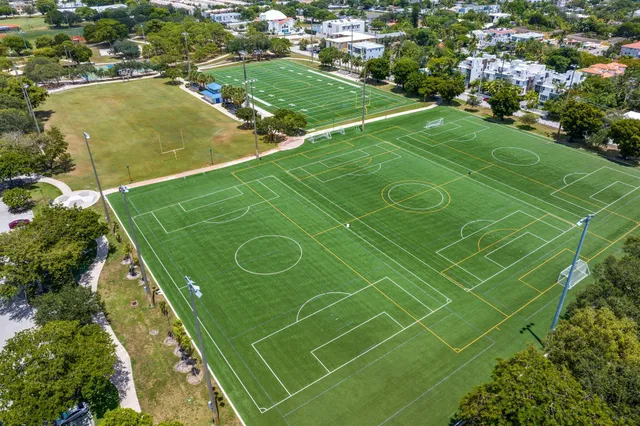 an aerial view of residential houses with outdoor space