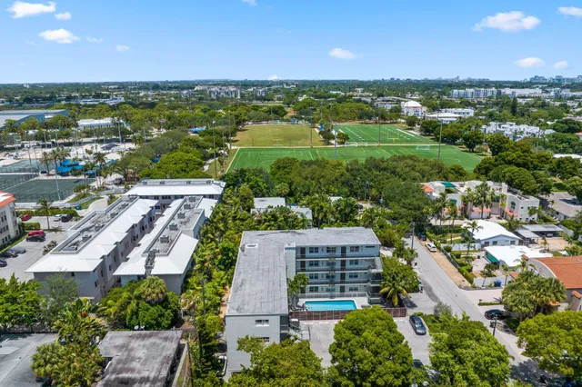 an aerial view of residential houses with outdoor space