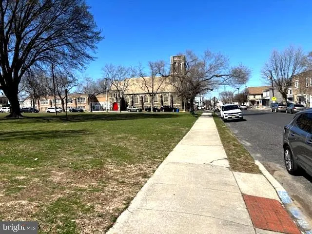 a view of a yard next to a building