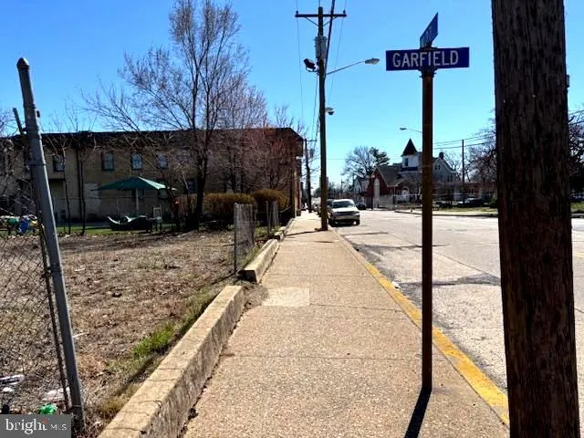 a view of a street with a tree