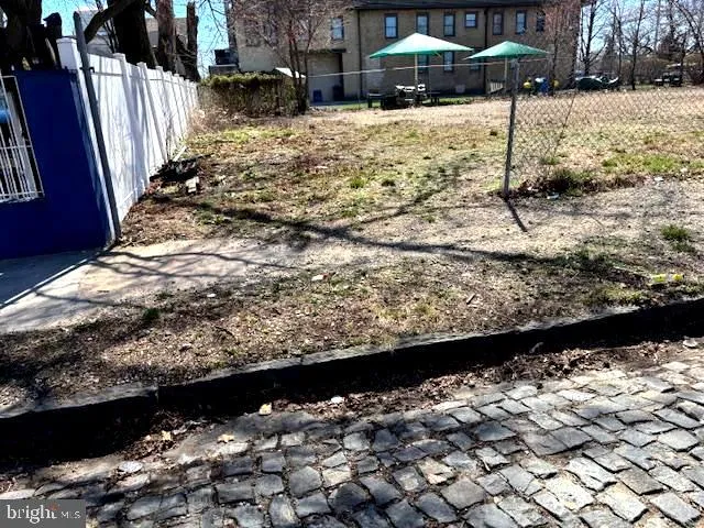 a view of a yard covered with snow