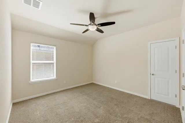 a view of empty room with windows