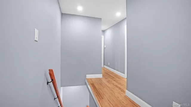 a view of room with wooden floor