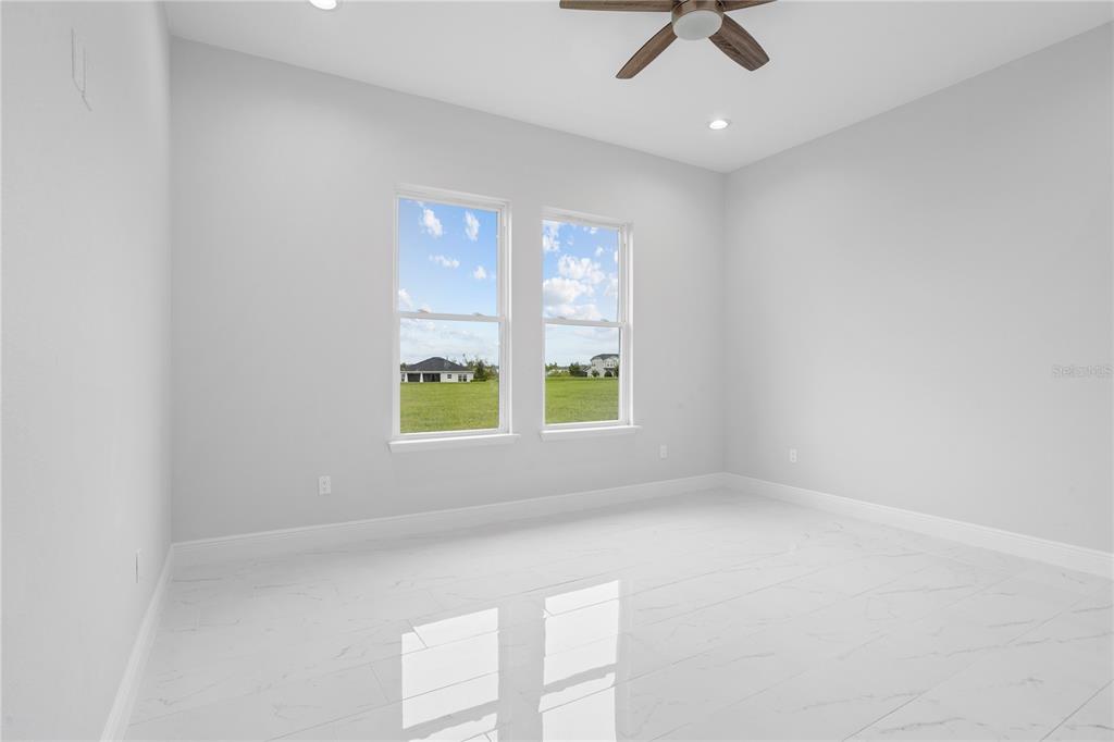 197 Valencia Ridge Drive Auburndale, FL 33823 - Photo 17 of 19 an empty room with a window