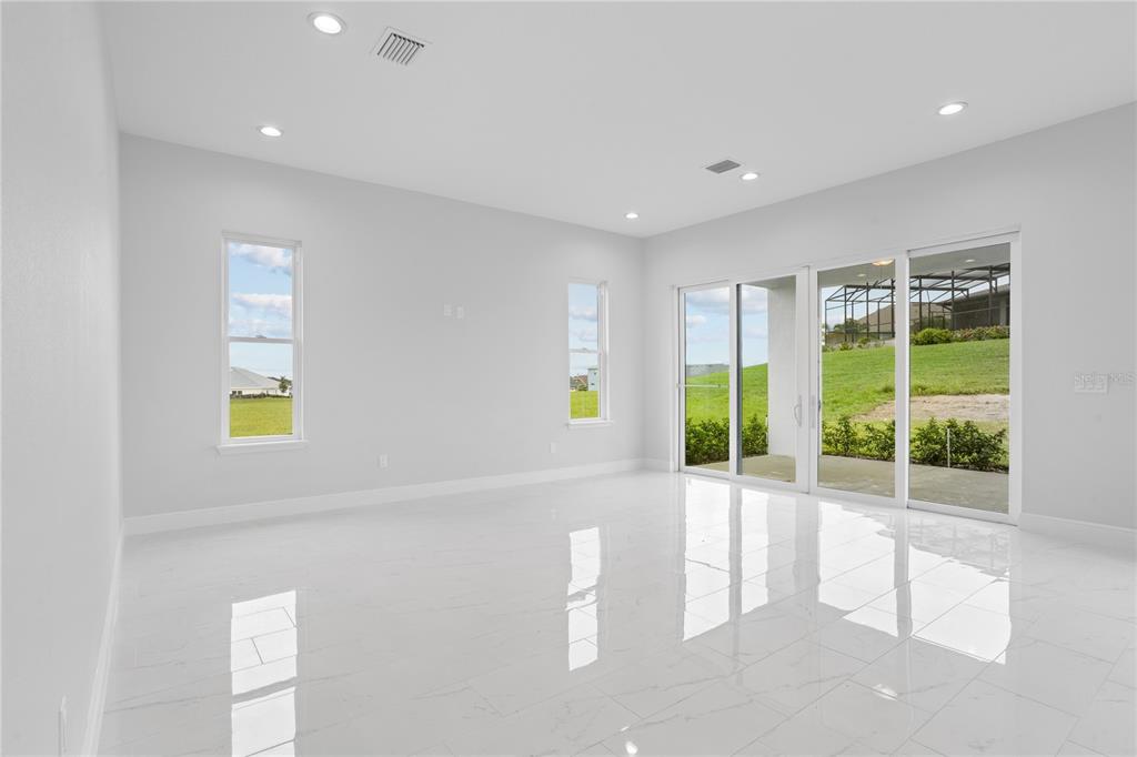 197 Valencia Ridge Drive Auburndale, FL 33823 - Photo 5 of 19 a view of an entryway with wooden floor