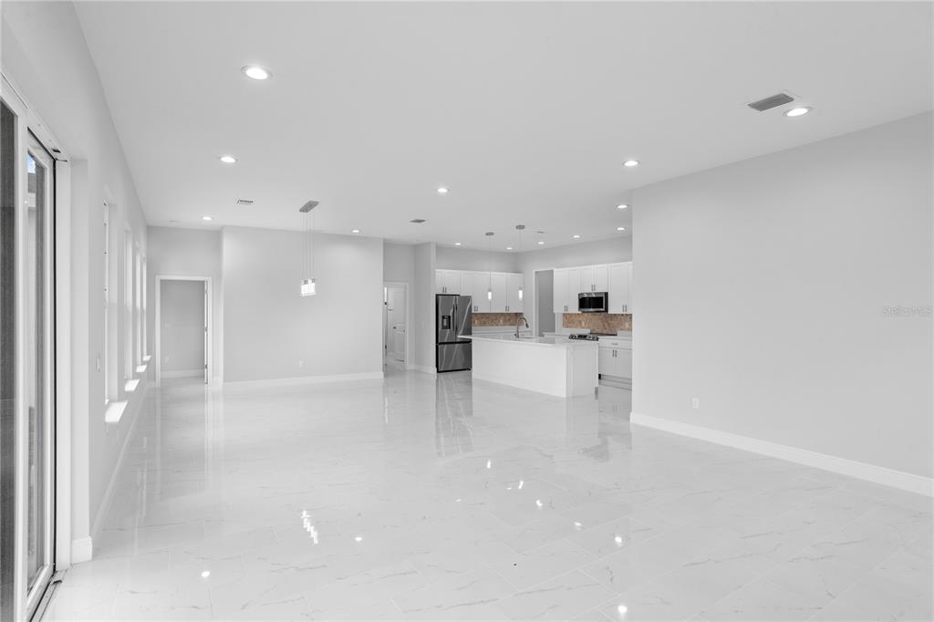 197 Valencia Ridge Drive Auburndale, FL 33823 - Photo 7 of 19 a view of kitchen with kitchen island and stainless steel appliances