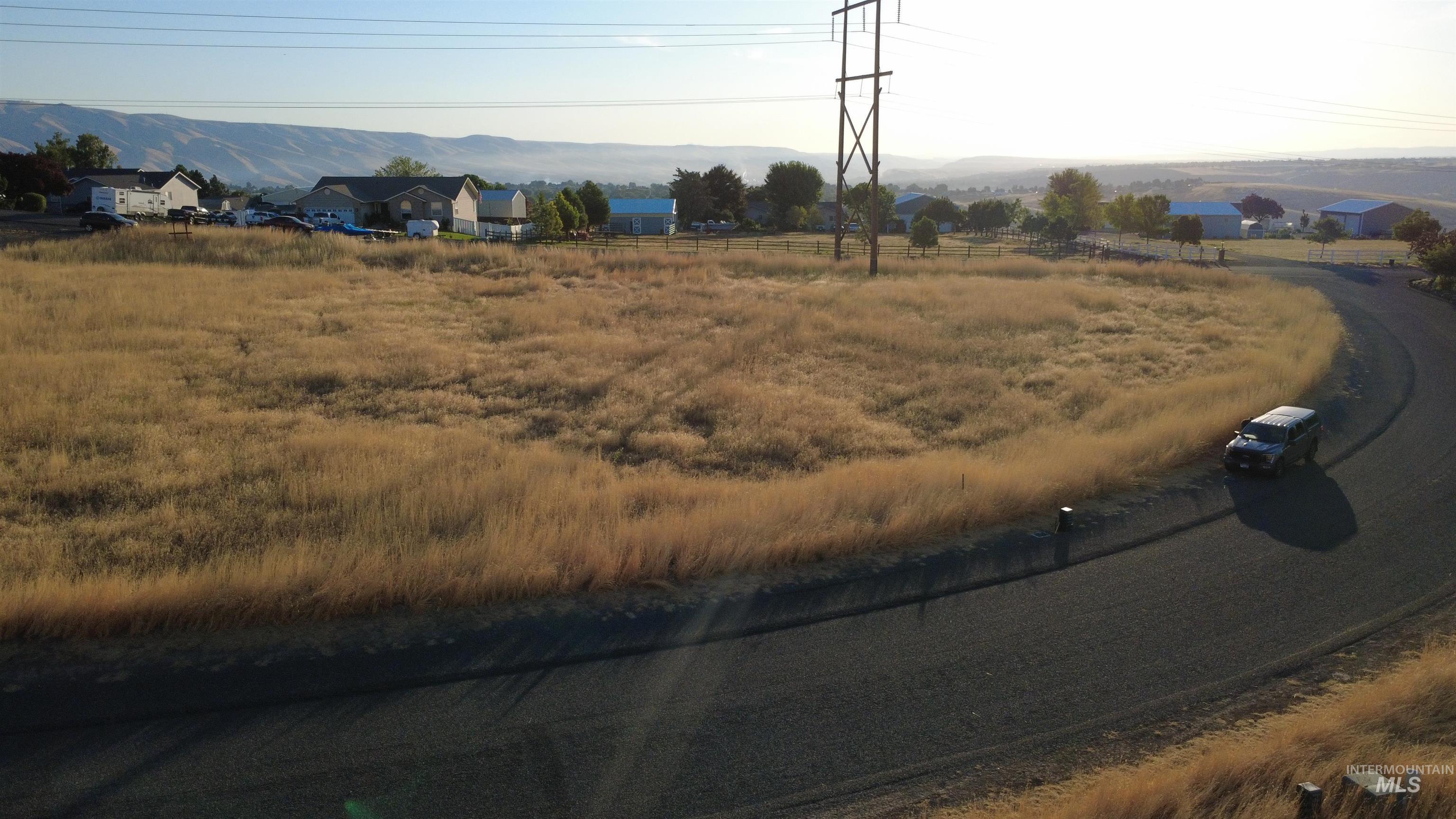2616 Dove Road Clarkston, WA 99403 - Photo 3 of 9 View of asphalt street featuring a mountain view and a rural view
