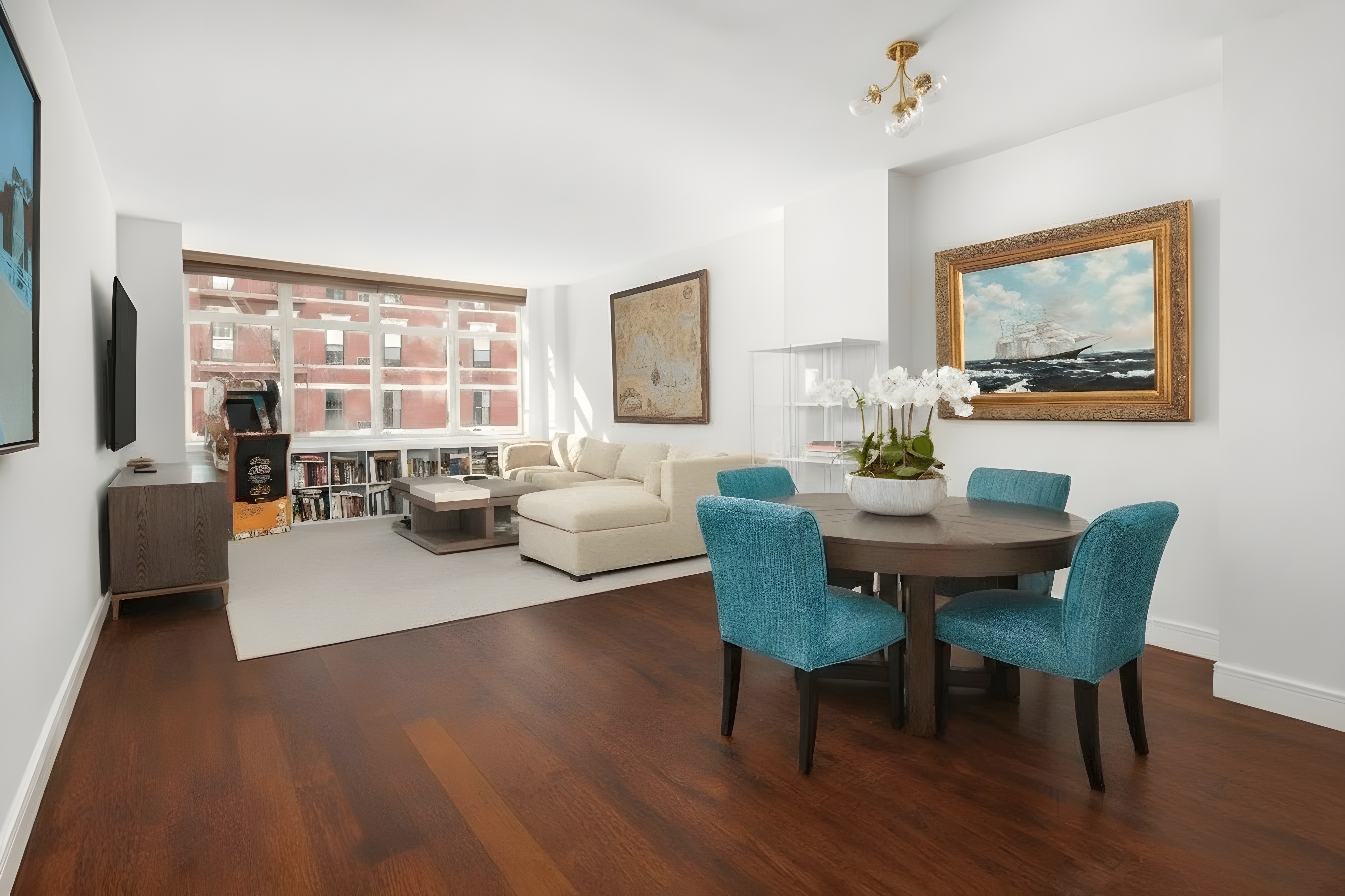 181 East 90th Street, Unit 4A Manhattan, NY 10128 - Photo 2 of 10 a living room with furniture and a large window