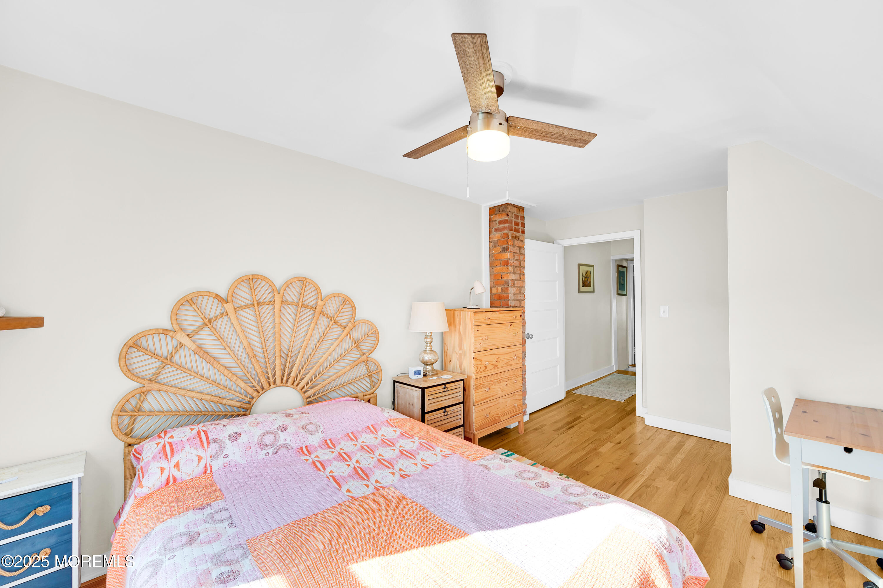 147 Webb Avenue Ocean Grove, NJ 07756 - Photo 19 of 34 a bedroom with a bed and a chandelier