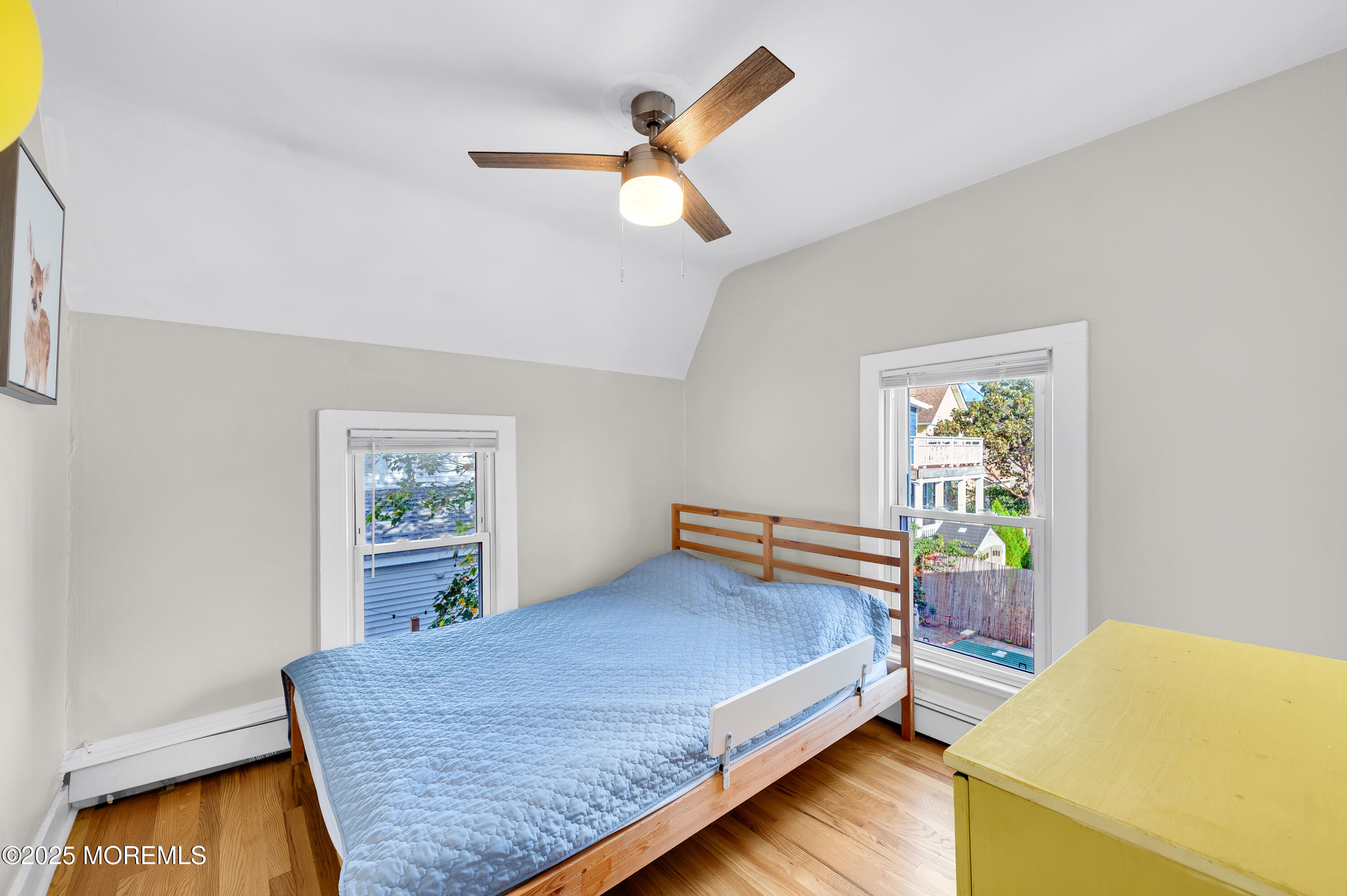 147 Webb Avenue Ocean Grove, NJ 07756 - Photo 20 of 34 a bedroom with a bed and a chandelier