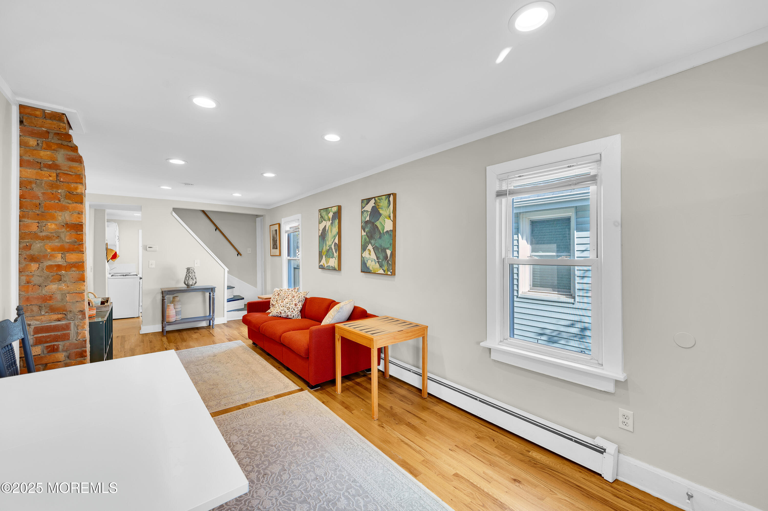 147 Webb Avenue Ocean Grove, NJ 07756 - Photo 10 of 34 a living room with furniture a ceiling fan and a window