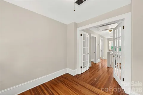 a view of bedroom with wooden floor