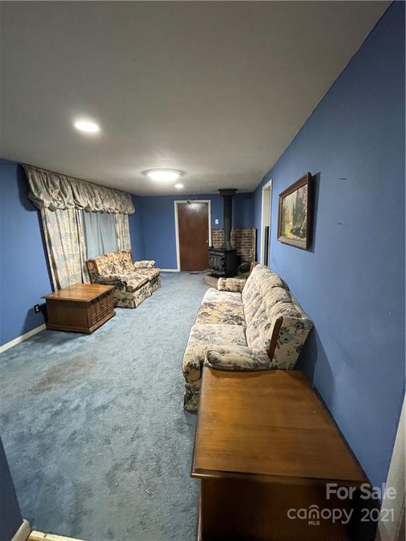 2808 Old Williams Road Raleigh, NC 27610 - Photo 4 of 16 a bed room with a bed and a television