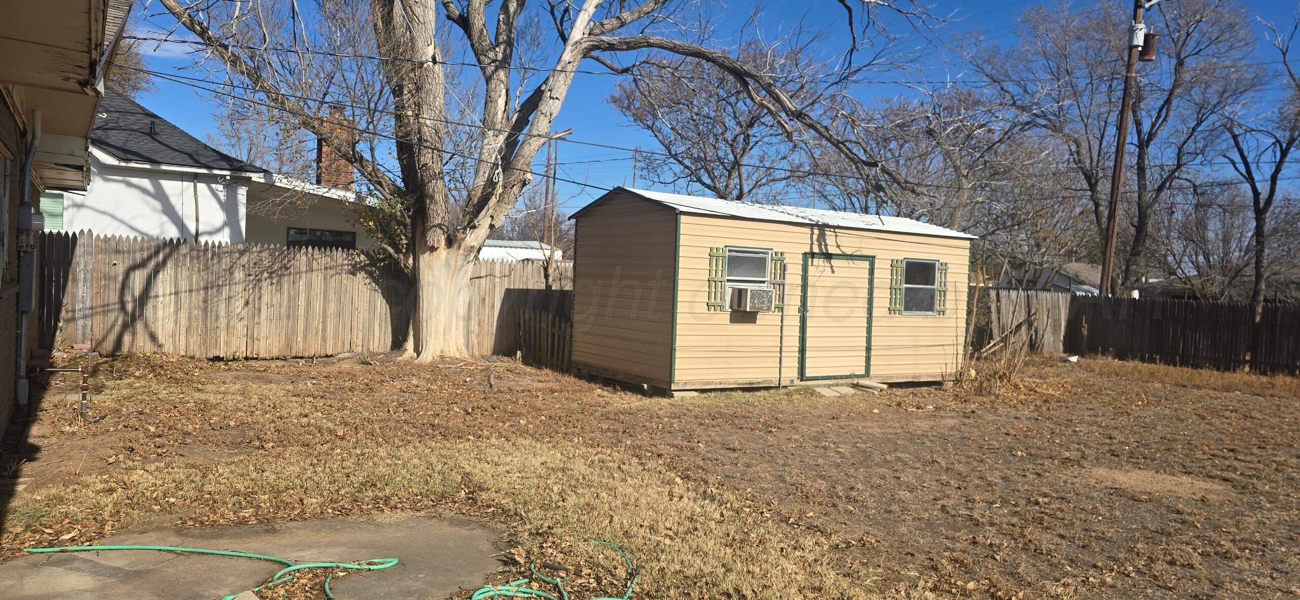 1307 Elm Avenue Dalhart, TX 79022 - Photo 4 of 5 a view of a house with a snow in the yard