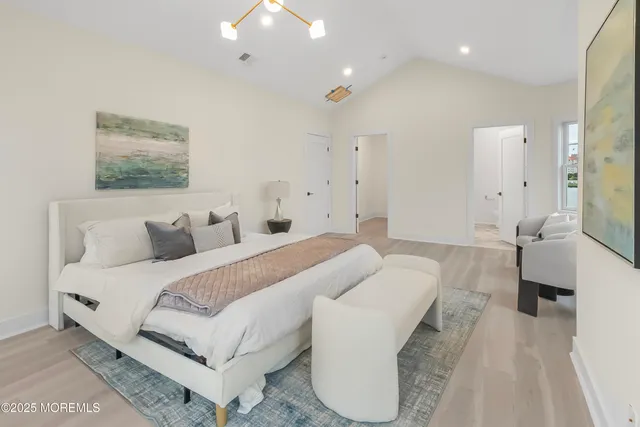 a spacious bedroom with a bed and a couch