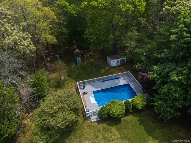 a wooden floor sitting in the middle of a lake