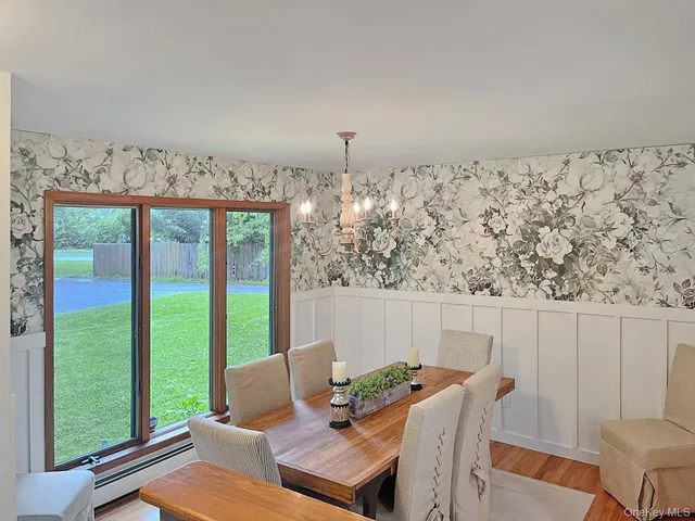 a view of a room with furniture and window