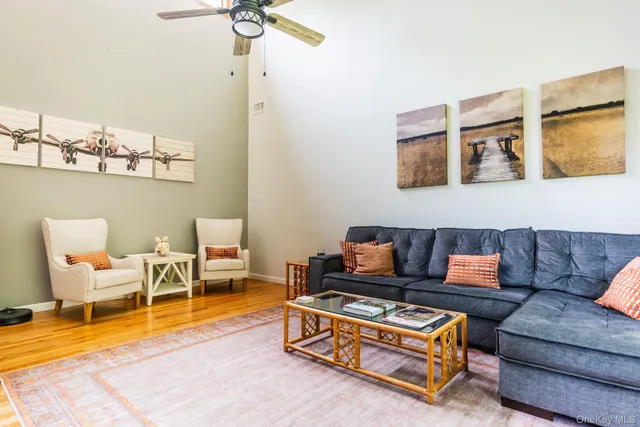a living room with furniture and a table
