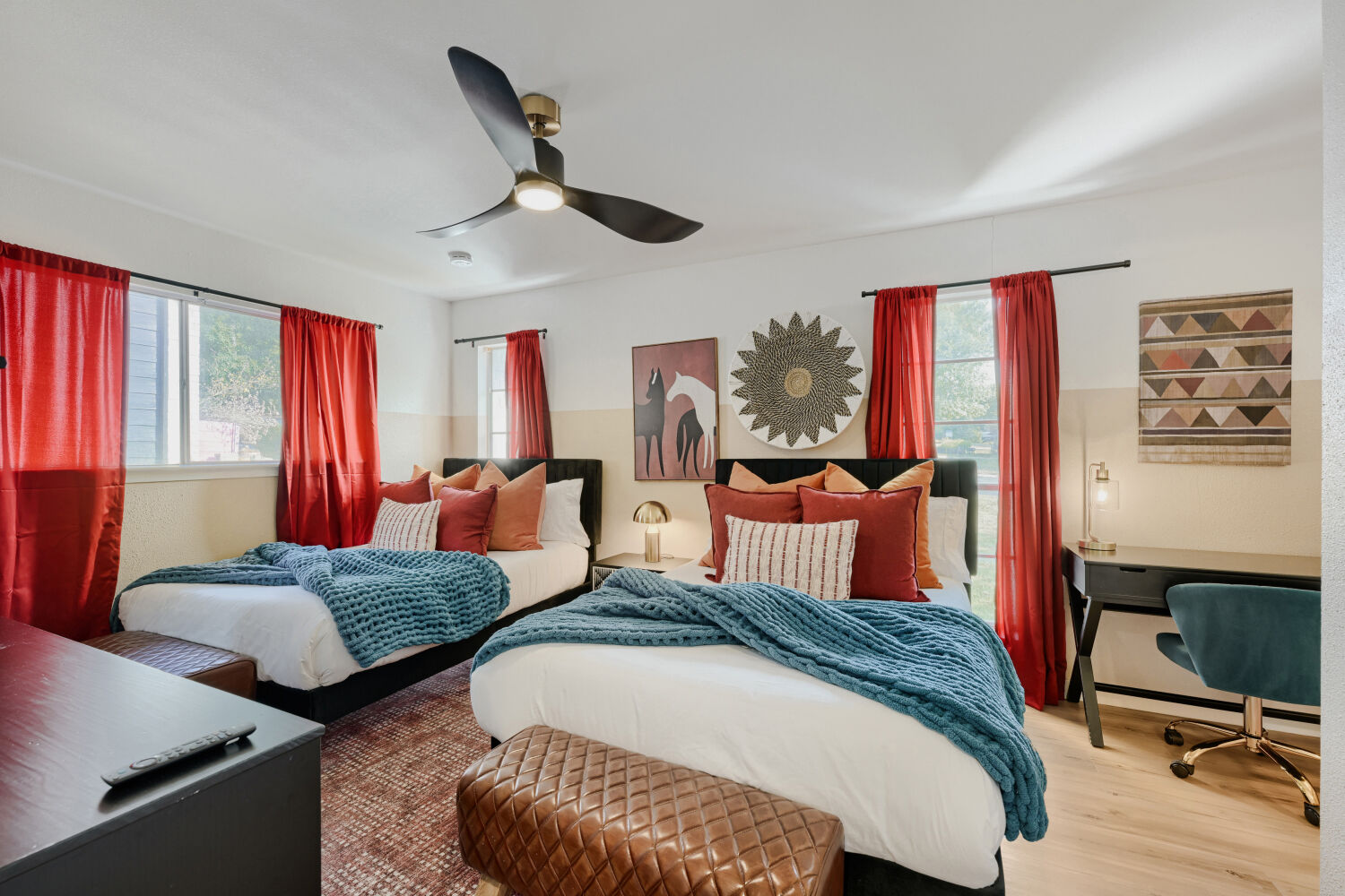 3410 Plantation Road Austin, TX 78745 - Photo 18 of 33 This restful bedroom features light wood flooring, large windows, and a sleek ceiling fan.
