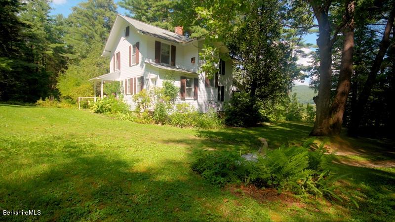 100 Fernside Road Lee, MA 01260 - Photo 1 of 18 a front view of a house with yard and green space