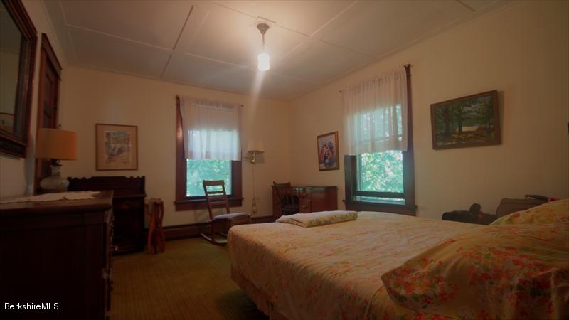 100 Fernside Road Lee, MA 01260 - Photo 11 of 18 a bedroom with a bed and a flat screen tv