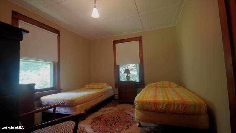 100 Fernside Road Lee, MA 01260 - Photo 12 of 18 a bedroom with a bed and a window