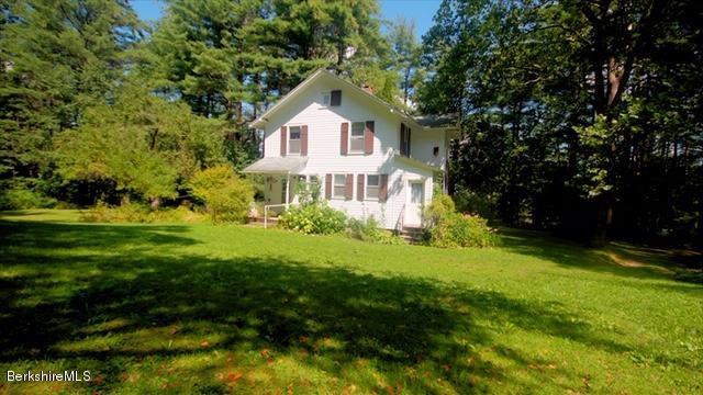 100 Fernside Road Lee, MA 01260 - Photo 14 of 18 a front view of house with yard and green space