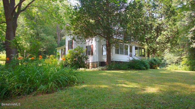 100 Fernside Road Lee, MA 01260 - Photo 3 of 18 a view of a house with a big yard and large trees