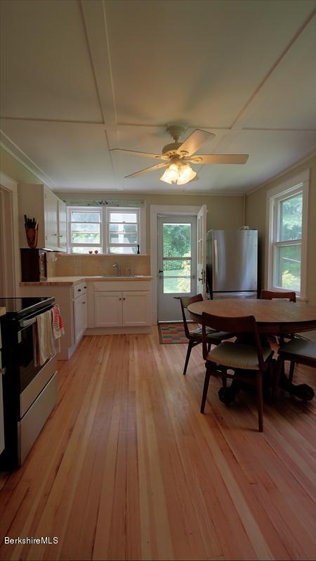 100 Fernside Road Lee, MA 01260 - Photo 4 of 18 a room with wooden floor table and chairs