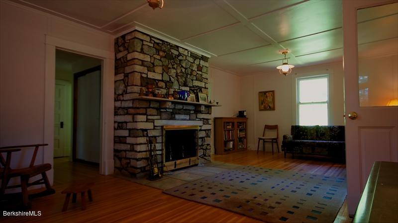 100 Fernside Road Lee, MA 01260 - Photo 7 of 18 a living room with furniture a fireplace and a flat screen tv