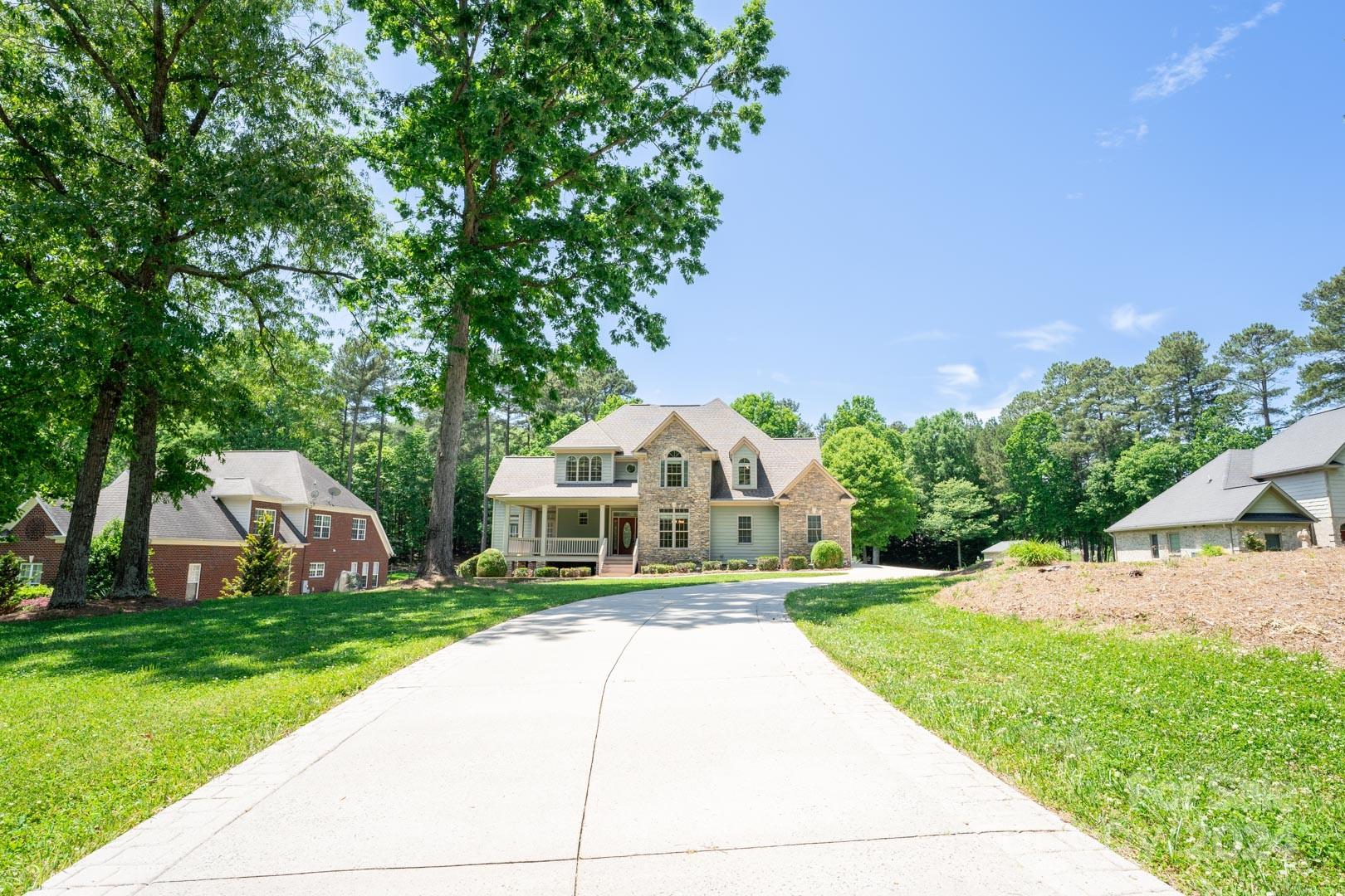 3563 Gordon Street Terrell, NC 28682 - Photo 11 of 45 a front view of a house with a yard and trees