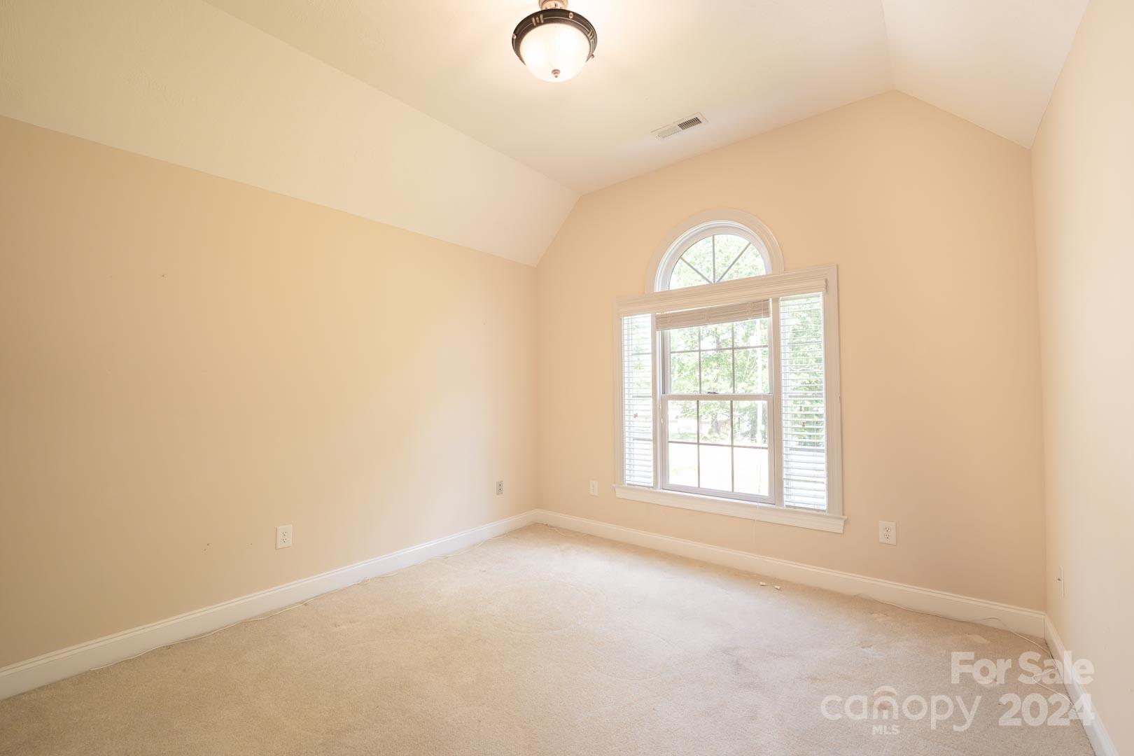 3563 Gordon Street Terrell, NC 28682 - Photo 39 of 45 an empty room with windows and mirror