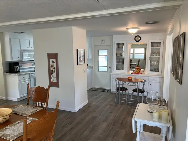 a living room with furniture window and wooden floor