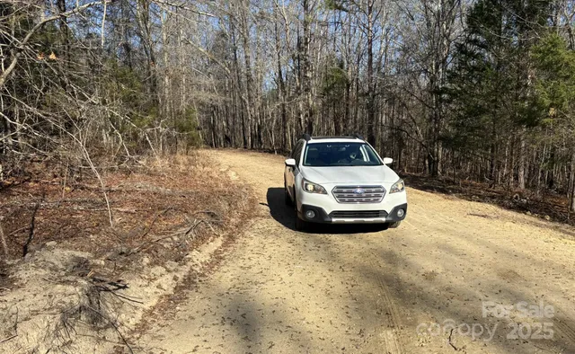 a car parked in the middle of a yard