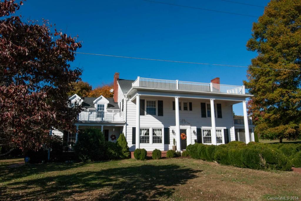 2670 Wilson Road China Grove, NC 28023 - Photo 1 of 24 a front view of a house with a garden