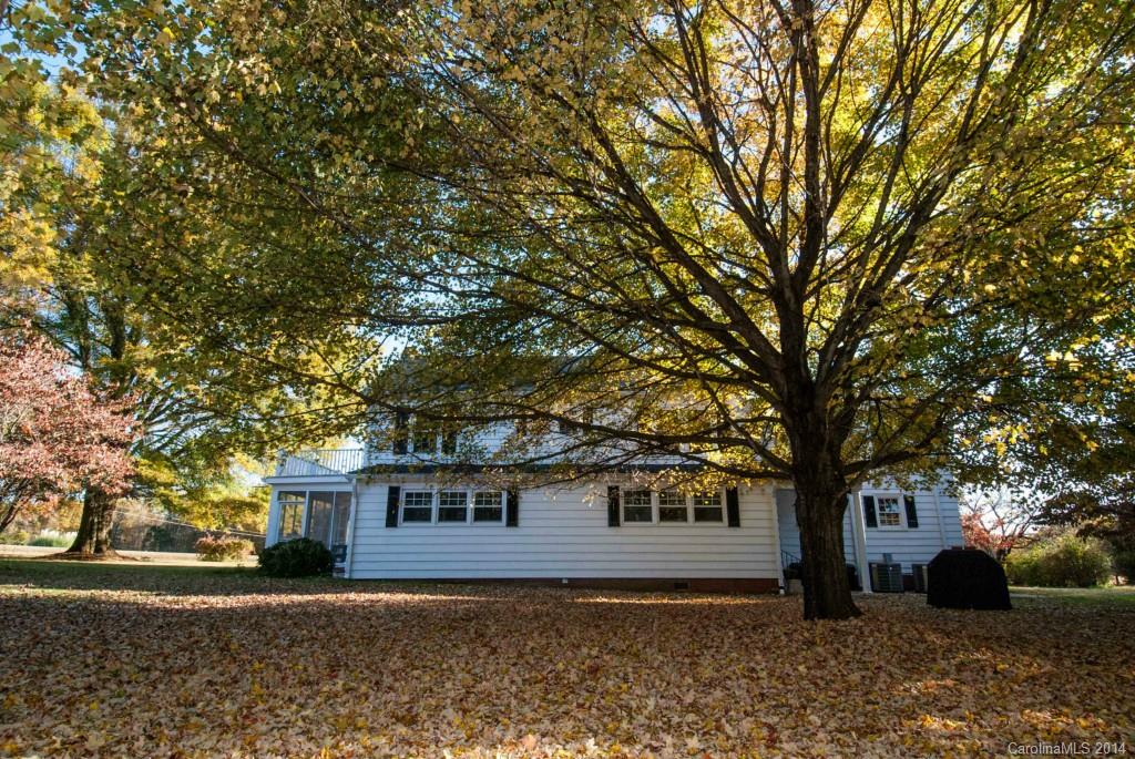 2670 Wilson Road China Grove, NC 28023 - Photo 18 of 24 a tree in front of a white house