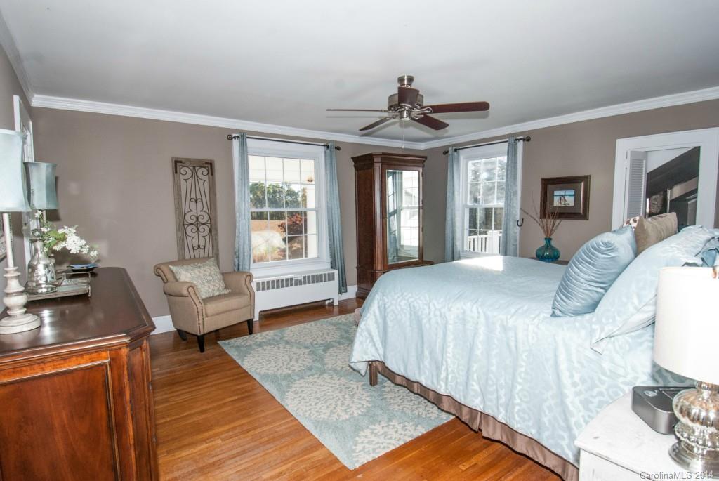 2670 Wilson Road China Grove, NC 28023 - Photo 9 of 24 a spacious bedroom with a bed couch table and a window