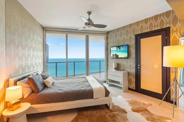 a bedroom with a bed and a couch