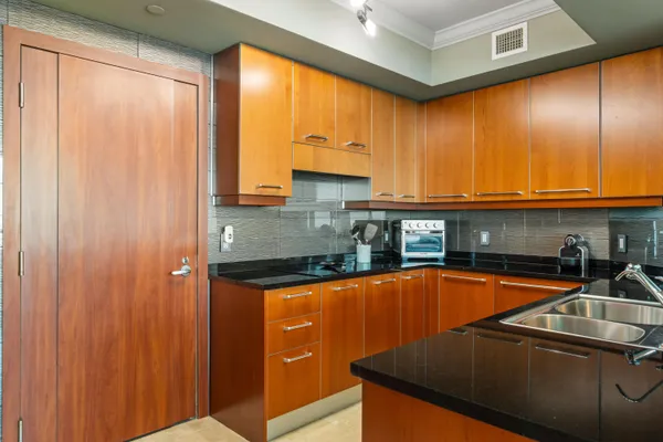 a living room with furniture a flat screen tv and a large window