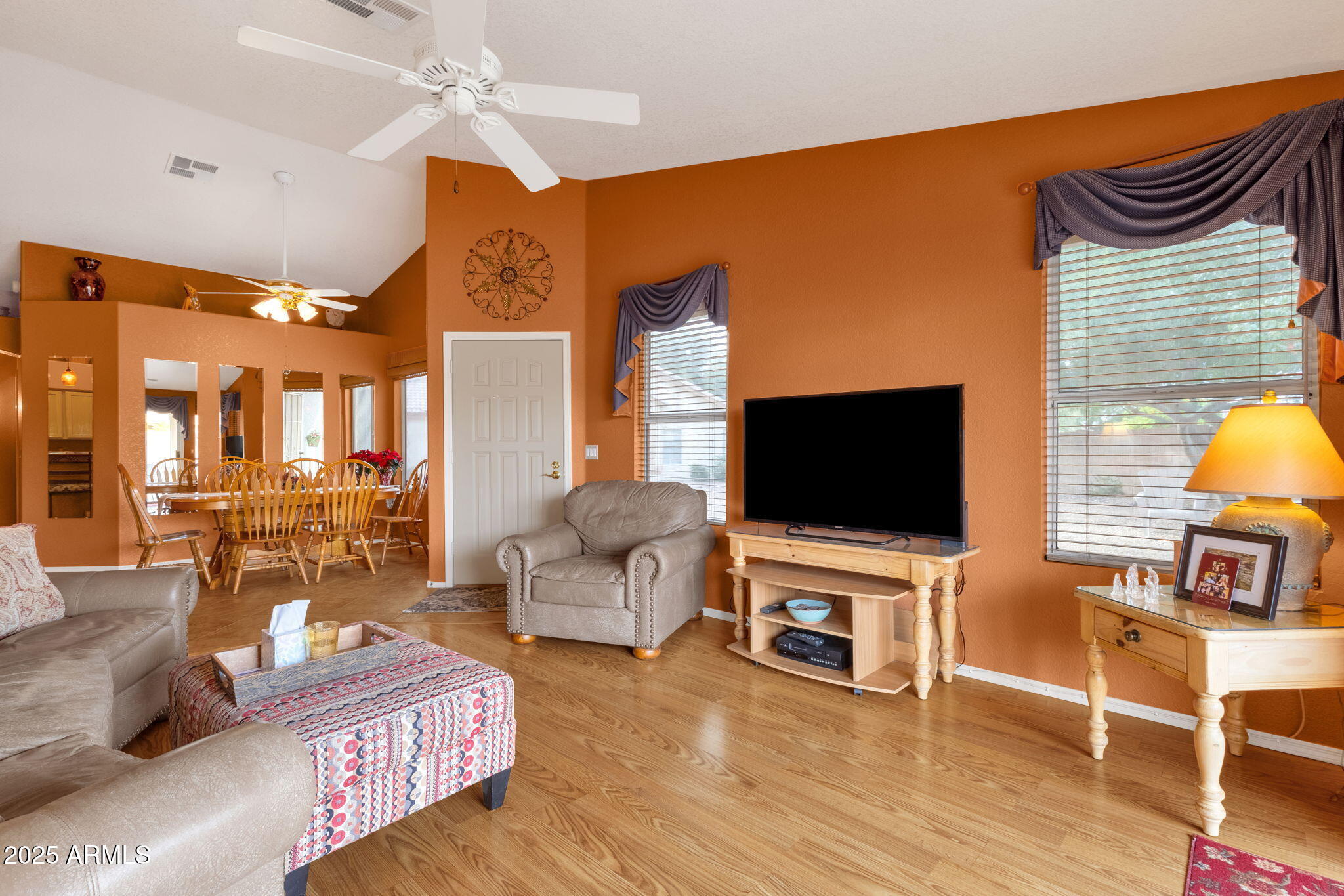 10408 West Burnett Road Peoria, AZ 85382 - Photo 11 of 30 a living room with furniture and a flat screen tv