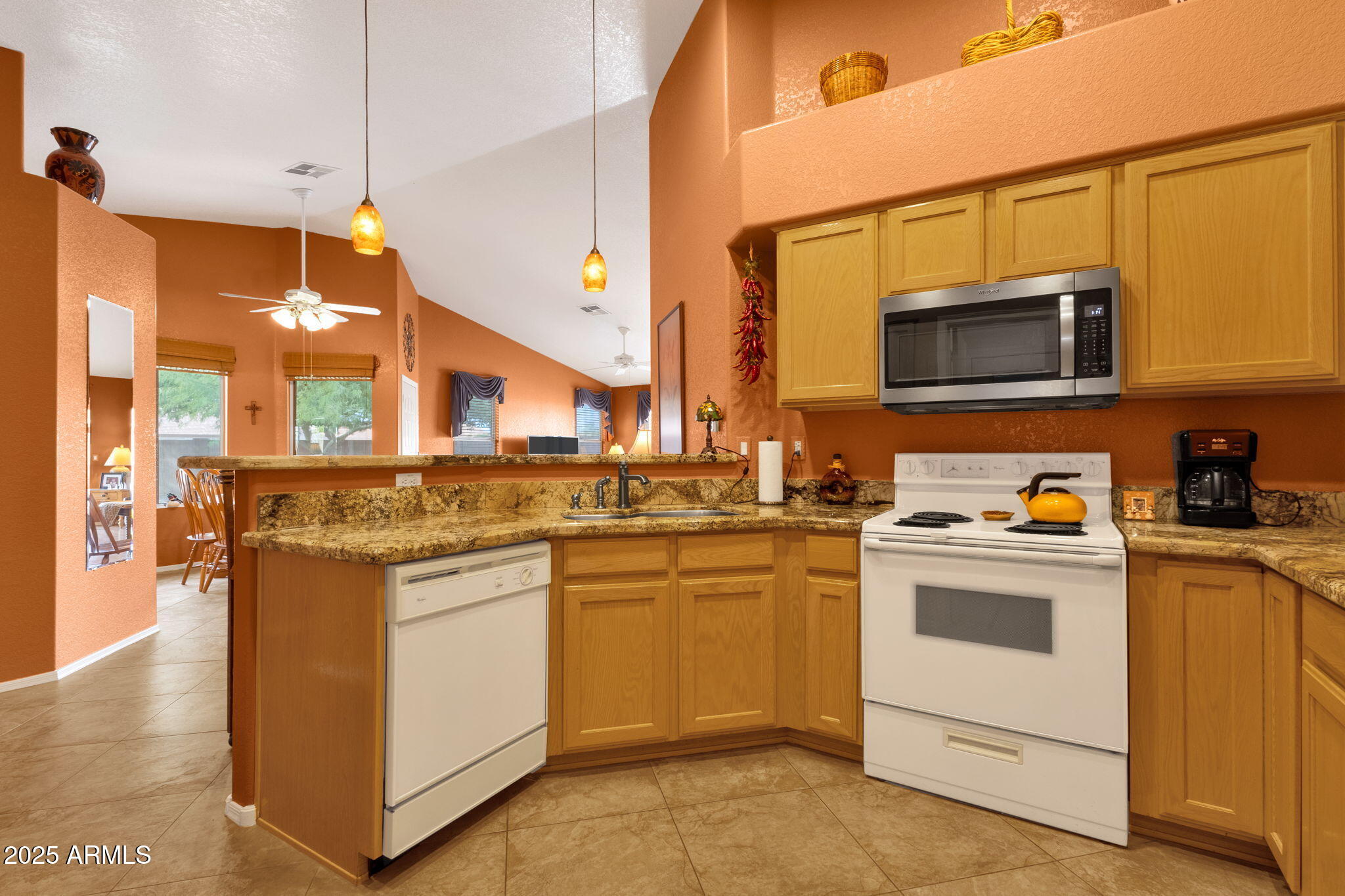 10408 West Burnett Road Peoria, AZ 85382 - Photo 17 of 30 a kitchen with stainless steel appliances granite countertop a stove and a sink