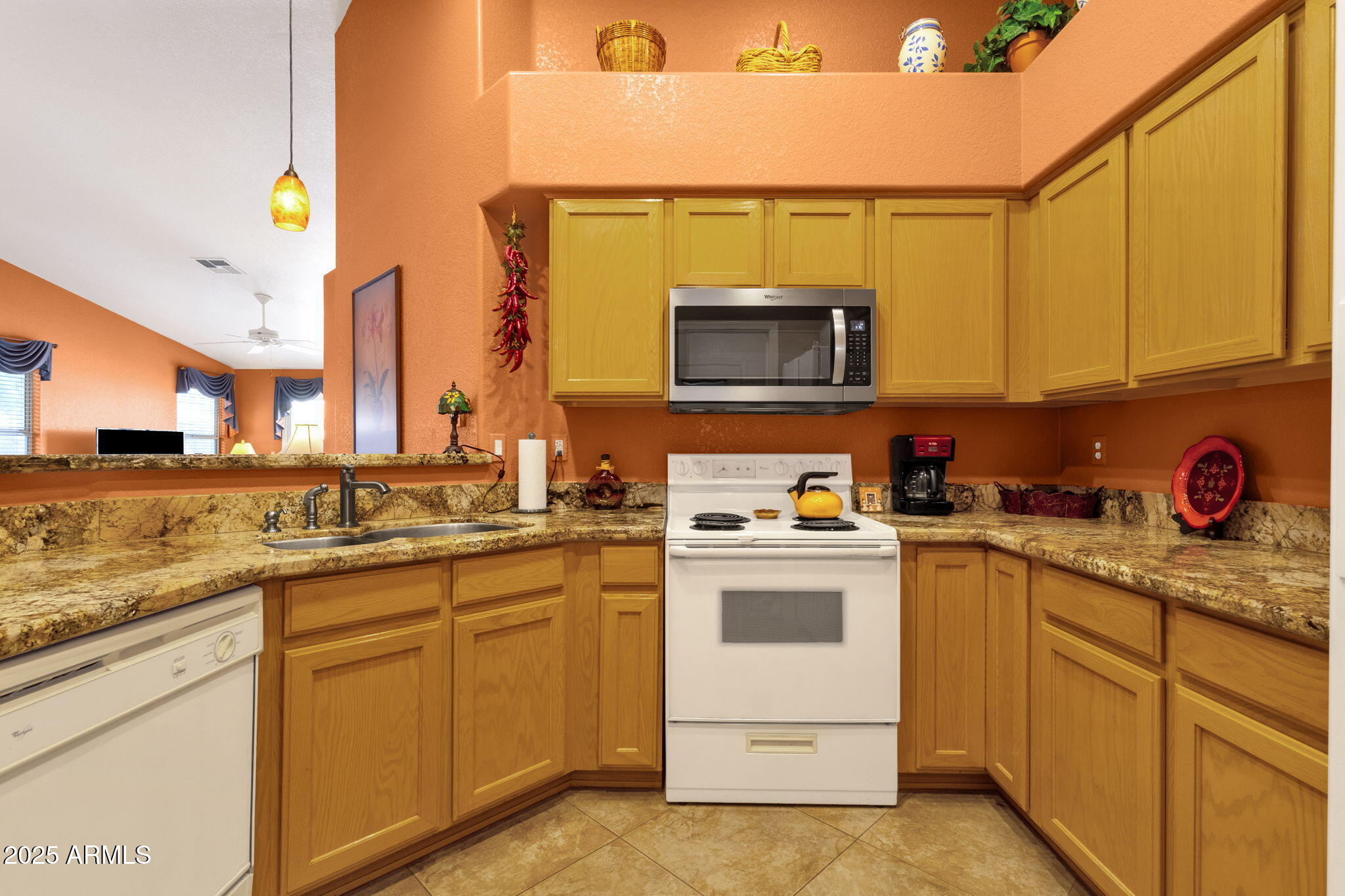 10408 West Burnett Road Peoria, AZ 85382 - Photo 18 of 30 a kitchen with sink cabinets and microwave