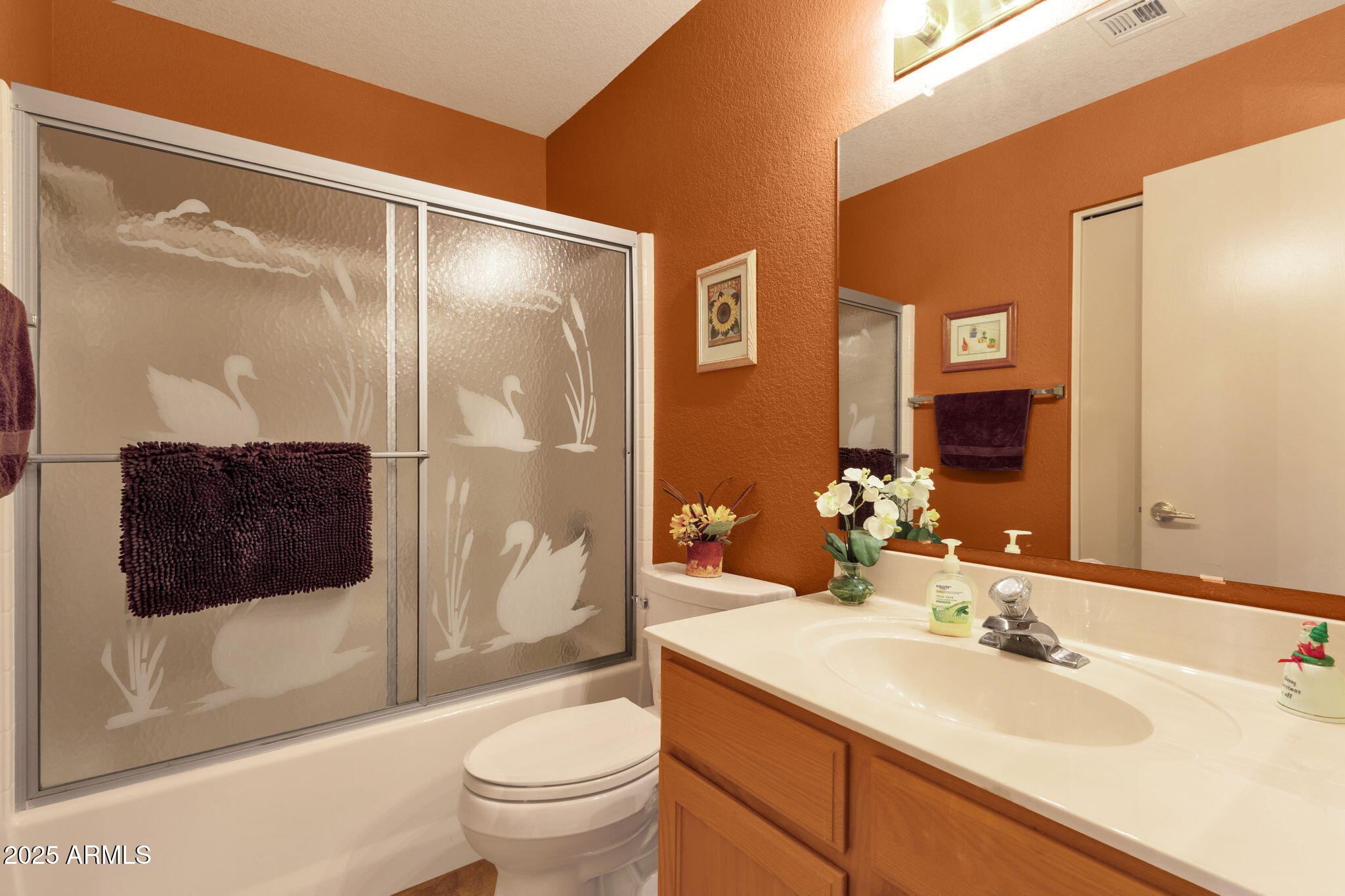 10408 West Burnett Road Peoria, AZ 85382 - Photo 19 of 30 a bathroom with a sink a toilet and shower