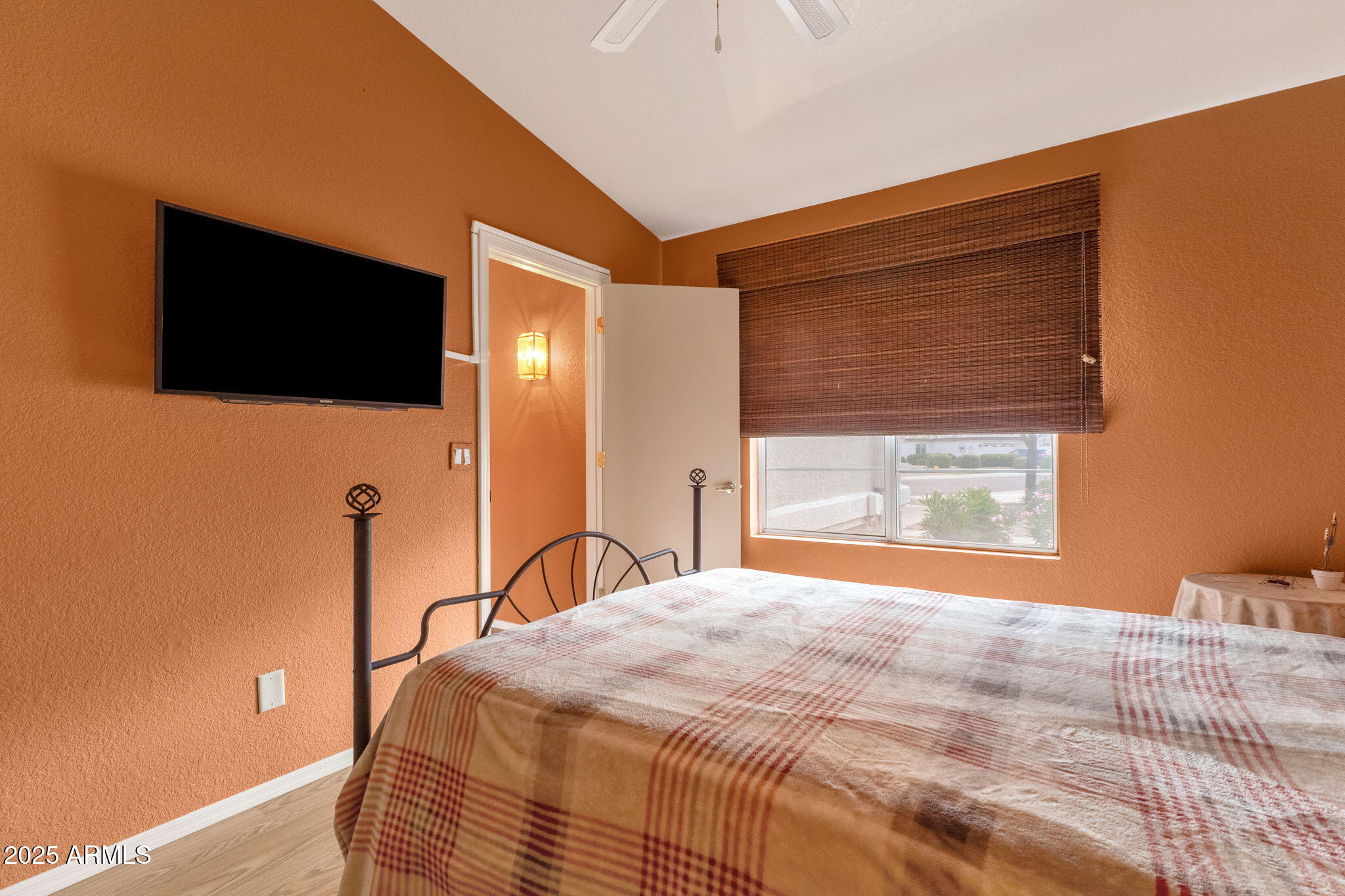 10408 West Burnett Road Peoria, AZ 85382 - Photo 20 of 30 a bedroom with a bed and a flat screen tv