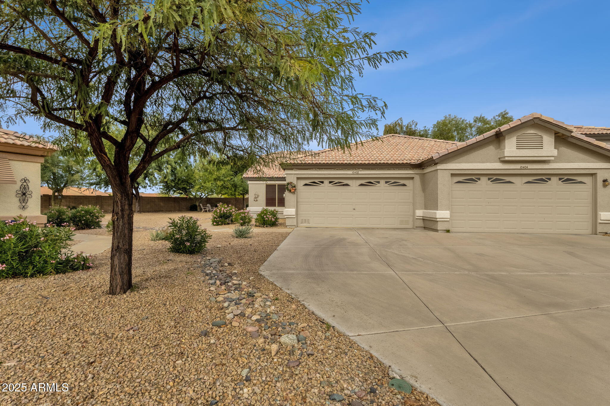 10408 West Burnett Road Peoria, AZ 85382 - Photo 2 of 30 a view of a house with a yard