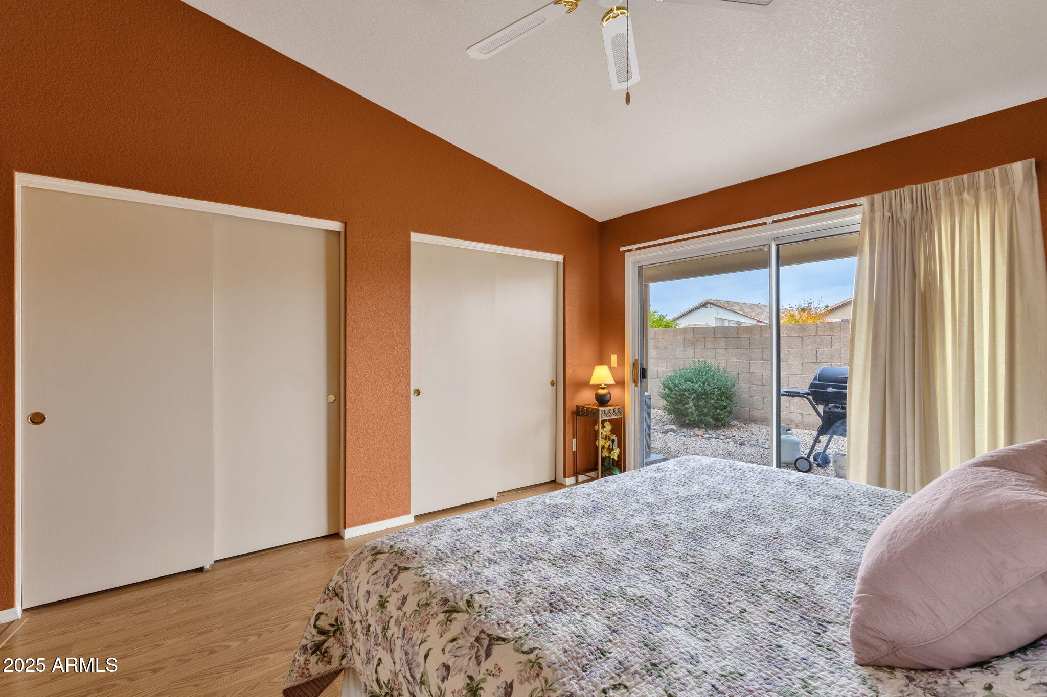 10408 West Burnett Road Peoria, AZ 85382 - Photo 23 of 30 a view of a bedroom with a large bed and large window