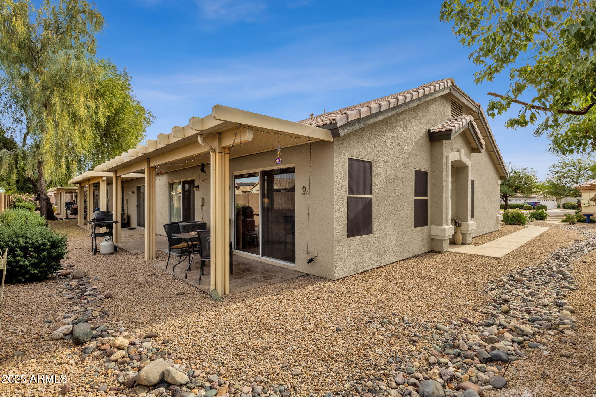 10408 West Burnett Road Peoria, AZ 85382 - Photo 28 of 30 a view of a house with a yard