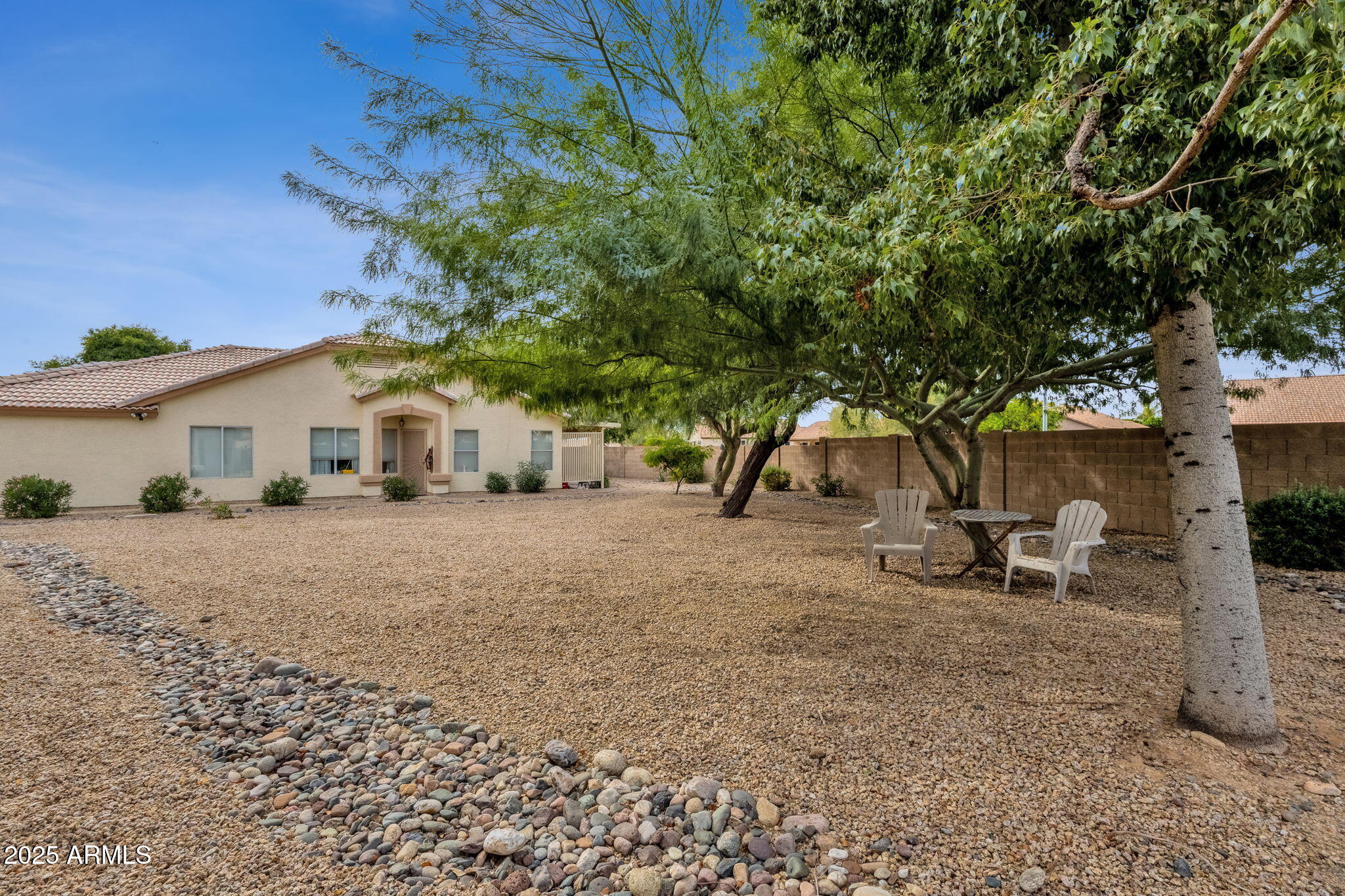 10408 West Burnett Road Peoria, AZ 85382 - Photo 6 of 30 a view of house with backyard and a tree