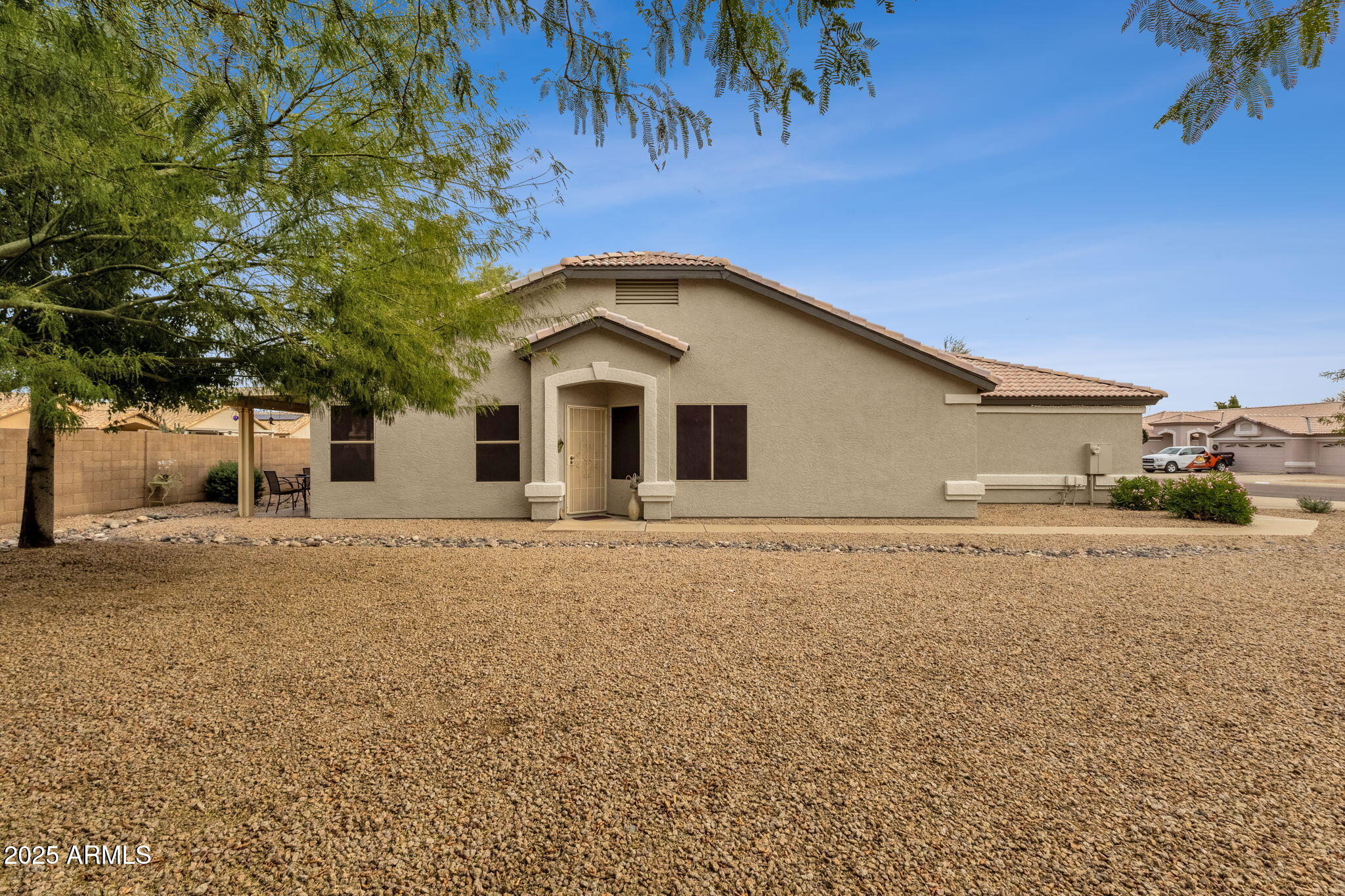 10408 West Burnett Road Peoria, AZ 85382 - Photo 7 of 30 a front view of a house with a yard